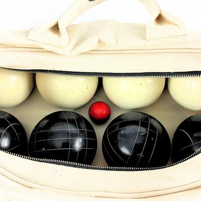 Sale Photo Thumbnail #223: Complete league edition bocce ball set featuring black and white bocce balls and a red target ball, all stored neatly in a durable canvas zippered carry case. Ideal for recreational play or serious competition.

Features:

Set Includes:
4 Black Bocce Ball