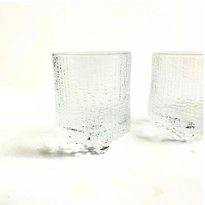 Sale Photo Thumbnail #211: This elegant set of IITTALA glassware includes:

Three clear textured glasses
One smoky gray textured glass
Renowned for its timeless Scandinavian design
Condition: Excellent vintage condition, showcasing IITTALA's iconic craftsmanship. Perfect for collec