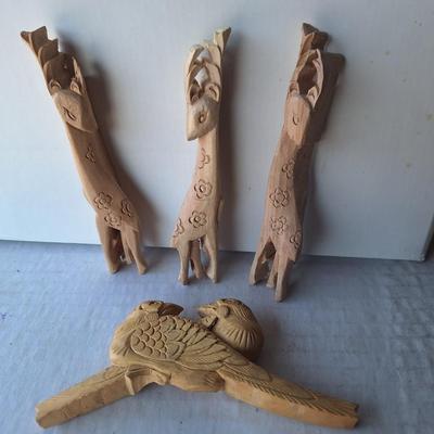 4 wooden animal figurines