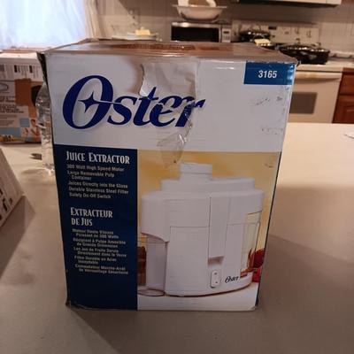 NEW OSTER JUICE EXTRACTOR
