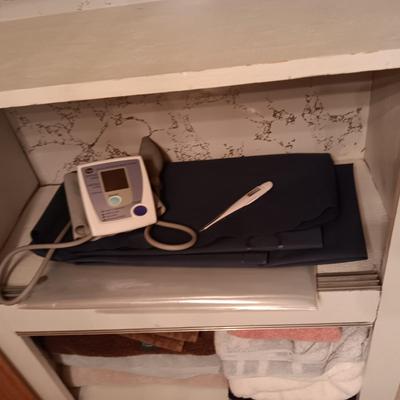 2 NAVY BLUE RUGS, TOWELS, BLOOD PRESSURE MONITOR AND MORE