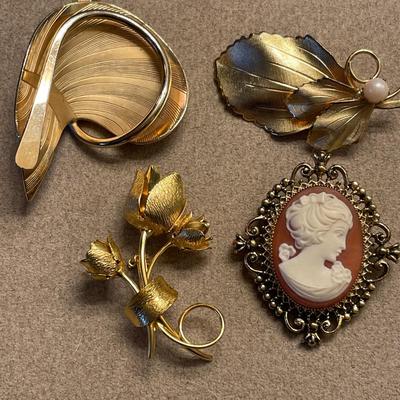 Gold tone brooches