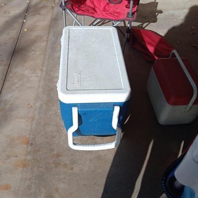 2 FOLDING CHAIRS, COLEMAN COOLER ON WHEELS, BEVERAGE AND SMALLER COOLER