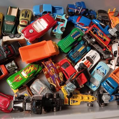 AN ASSORTMENT OF TOY CARS