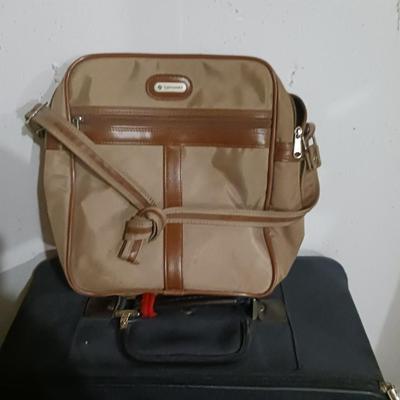 SUITCASE, NECK PILLOW AND CARRY ON BAGS