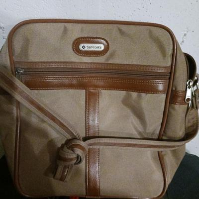 SUITCASE, NECK PILLOW AND CARRY ON BAGS
