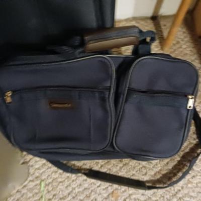 SUITCASE, NECK PILLOW AND CARRY ON BAGS