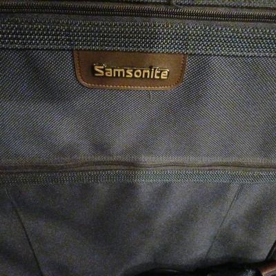 SUITCASE, NECK PILLOW AND CARRY ON BAGS