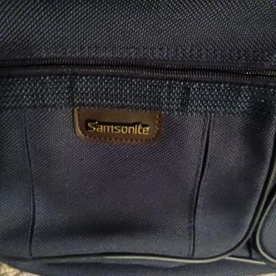 SUITCASE, NECK PILLOW AND CARRY ON BAGS