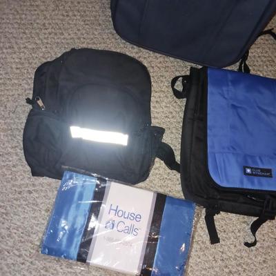 SUITCASE AND SEVERAL SMALLER BAGS