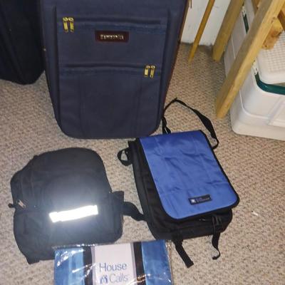 SUITCASE AND SEVERAL SMALLER BAGS
