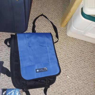SUITCASE AND SEVERAL SMALLER BAGS