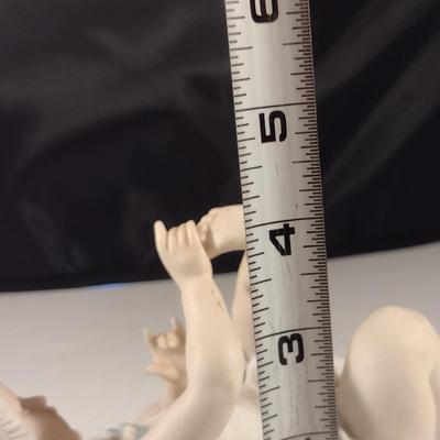 Porcelain Child Figurine