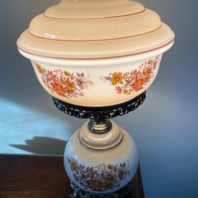 Vintage hurricane lamp with orange and yellow flowers