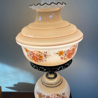 Vintage hurricane lamp with orange and yellow flowers