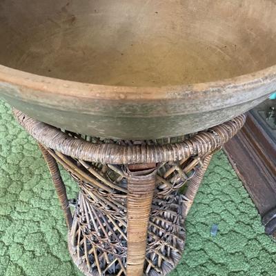 Wicker base with large wood bowl on top