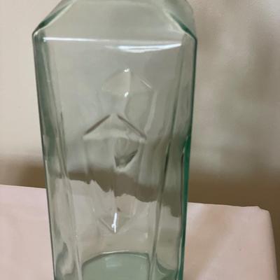 Blue glass bottle with dark cork stopper