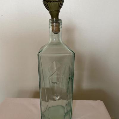 Blue glass bottle with dark cork stopper