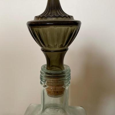 Blue glass bottle with dark cork stopper