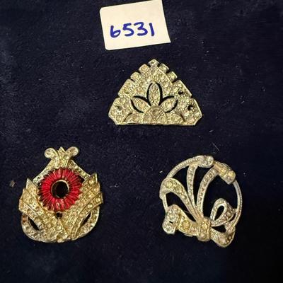 Broaches without backs