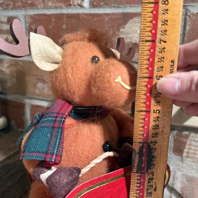Reindeer on a cardboard sled