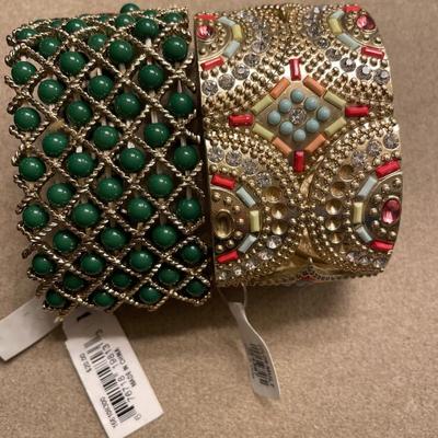 2 stretchy bracelets with price tags