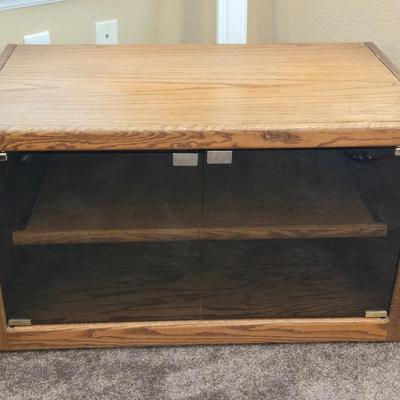 Television Stand with Pull Out Shelf and Glass Doors