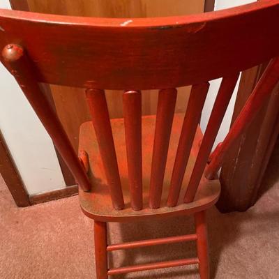 Vintage red chair with autumn theme blanket