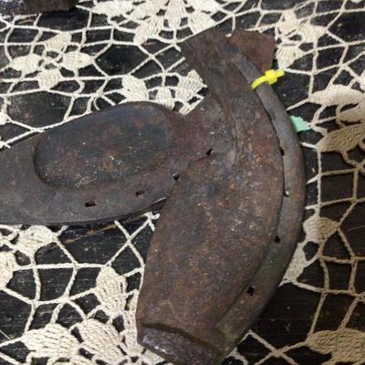 Cast Iron Lady Door Stop, Metal Bird, and Oxen Hoof Shoes.