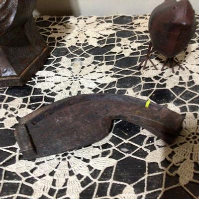 Cast Iron Lady Door Stop, Metal Bird, and Oxen Hoof Shoes.