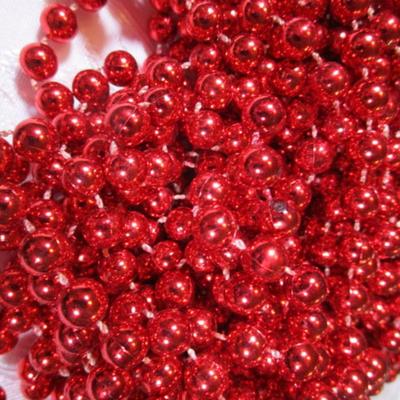 Shiny red strings of beads