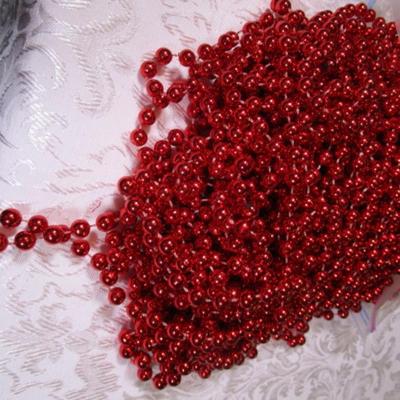Shiny red strings of beads