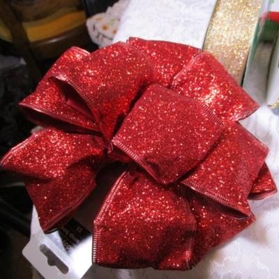 4 spools of Christmas ribbon, large red shiny bow