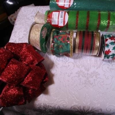 4 spools of Christmas ribbon, large red shiny bow