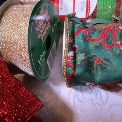 4 spools of Christmas ribbon, large red shiny bow