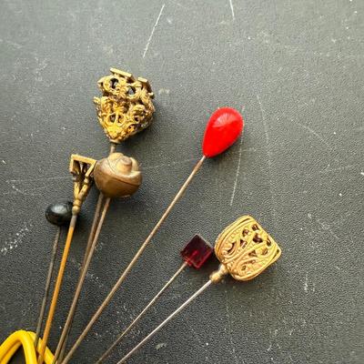 Hat pins/precious moments pin cushion/earrings