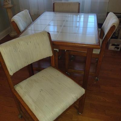 Tile Topped Wooden Framed Table with Four Rolling Chairs- Measures Approx 35" x 42 1/2" x 29" Tall