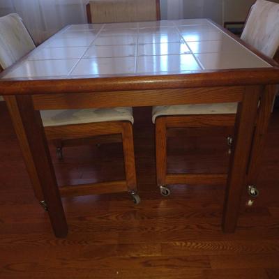 Tile Topped Wooden Framed Table with Four Rolling Chairs- Measures Approx 35" x 42 1/2" x 29" Tall