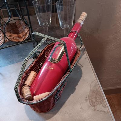 TALL EMPTY CHAMPAGNE BOTTLE, WINE RACK, BOTTLE HOLDER AND 4 STEMMED GLASSES