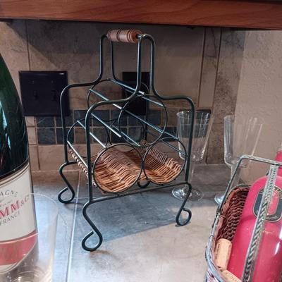 TALL EMPTY CHAMPAGNE BOTTLE, WINE RACK, BOTTLE HOLDER AND 4 STEMMED GLASSES