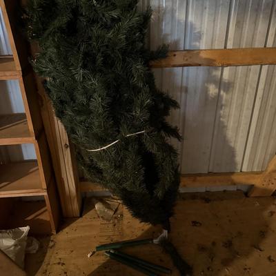 Christmas tree-parts are there for the stand,I wasn’t strong enough to get it together