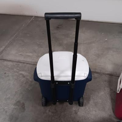 COLEMAN KWIK SERV COOLER AND ANOTHER ON WHEELS PLUS A LUNCH BAG AND UMBRELLA