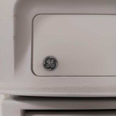 GE ELECTRIC OVEN IN A 3 DRAWER DROP LEAF CABINET ON CASTERS