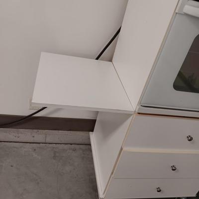 GE ELECTRIC OVEN IN A 3 DRAWER DROP LEAF CABINET ON CASTERS