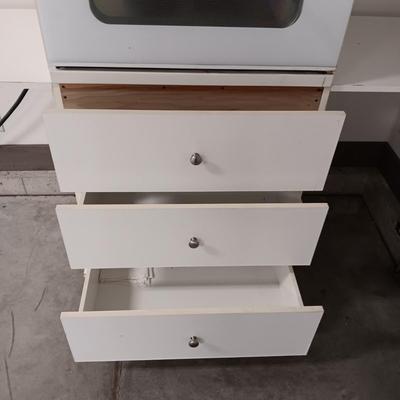 GE ELECTRIC OVEN IN A 3 DRAWER DROP LEAF CABINET ON CASTERS