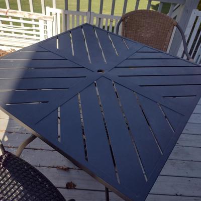 Metal Patio Table with Umbrella Stand and Two Mismatched Chairs