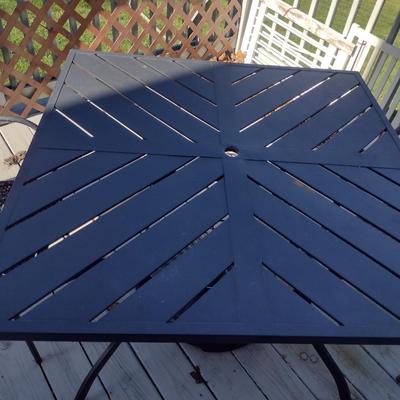 Metal Patio Table with Umbrella Stand and Two Mismatched Chairs