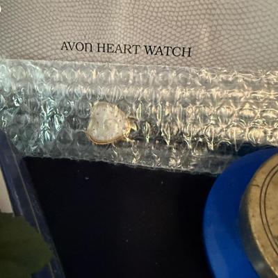Avon watch, courage, ring