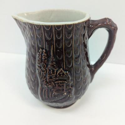 Antique Brown Stoneware Pitcher With Brown Glaze House Relief Pattern