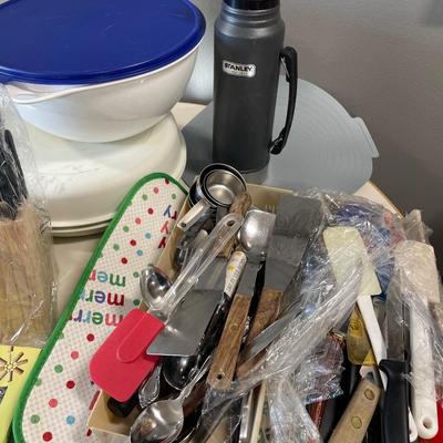 Kitchen items including Tupperware and Corningware